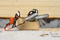 When construction a wooden house, two chainsaws a bit. Royalty Free Stock Photo