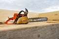 When construction a wooden house, two chainsaws a bit Royalty Free Stock Photo