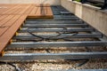 Construction of a wooden terrace on a balcony. A new wooden, timber deck being constructed. Royalty Free Stock Photo