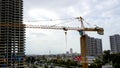 A construction work and a crane in a city