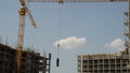 Construction work on a new building of a residential complex and a house