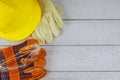 Construction work safety protective equipment with yellow hard hat helmet and a pair of working gloves safety glasses Royalty Free Stock Photo