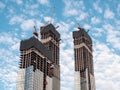 Construction work site and high rise building. Elevators lifts to the construction sites of a skyscraper under construction Royalty Free Stock Photo