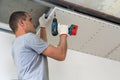 Construction worker assemble a suspended ceiling with drywall an Royalty Free Stock Photo