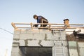 Construction worker assembling cement formwork. Worker is roofing Royalty Free Stock Photo