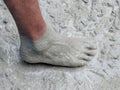 Construction worker barefoot in liquid concrete Royalty Free Stock Photo