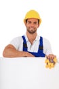 Construction worker behind blank white sign Royalty Free Stock Photo