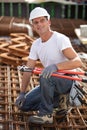 construction worker with bolt croppers on reinforcement bars Royalty Free Stock Photo