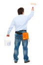 Construction worker with bucket and brush painting Royalty Free Stock Photo