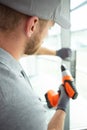 Construction worker building drilling frame in new home Royalty Free Stock Photo