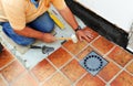 Construction worker building the floor of the courtyard of a house