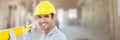 Construction Worker on building site holding spirit level Royalty Free Stock Photo