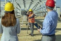 Construction Worker With Business Team at a Construction Site Royalty Free Stock Photo