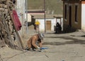 Construction worker busy working in mud village, Spiti Valley, Himachal Pradesh, India