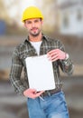 Construction Worker with chart in front of construction site Royalty Free Stock Photo