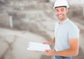 Construction Worker with chart in front of construction site Royalty Free Stock Photo