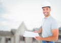 Construction Worker with chart in front of construction site Royalty Free Stock Photo