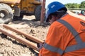 Construction worker checking his mobile phone on a building site Royalty Free Stock Photo