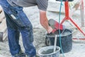Construction worker is cleaning a shovel Royalty Free Stock Photo