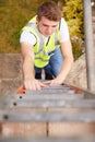 Construction Worker Climbing Ladder On Building Site Royalty Free Stock Photo