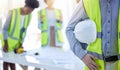 Construction worker, closeup and helmet with arm of engineer, builder or contractor. Industrial team, handyman gear and Royalty Free Stock Photo