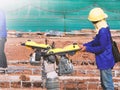 Construction worker compacting soil