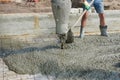 Construction worker concretes floors at a construction site Royalty Free Stock Photo