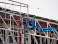 Construction worker using lifting boom Royalty Free Stock Photo