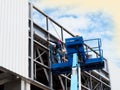 Construction worker using lifting boom Royalty Free Stock Photo