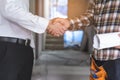 Construction worker and contractor. Client shaking hands with team builder in renovation site Royalty Free Stock Photo