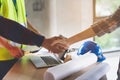 Construction worker and contractor. Client shaking hands with team builder. Royalty Free Stock Photo