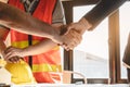 Construction worker and contractor. Client shaking hands with team builder in renovation site Royalty Free Stock Photo