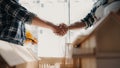 construction worker and contractor. Client shaking hands with team builder in renovation site in the morning Royalty Free Stock Photo