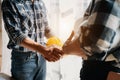 construction worker and contractor. Client shaking hands with team builder in renovation site in the morning Royalty Free Stock Photo