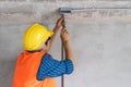 Electrician prepare to wire electric system on the ceiling in reconstruction room Royalty Free Stock Photo