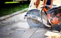 Construction worker cutting Asphalt paving for sidewalk Royalty Free Stock Photo