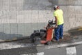 Construction worker cutting concrete floor Royalty Free Stock Photo