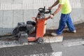 Construction worker cutting concrete floor Royalty Free Stock Photo