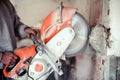 construction worker cutting concrete with a professional concrete chainsaw Royalty Free Stock Photo