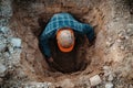 Construction worker digging hole top view Royalty Free Stock Photo
