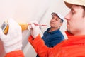 Construction worker doing measuring