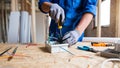 Construction worker or electrician carefully connecting and securing electrical wires in a junction box. Royalty Free Stock Photo