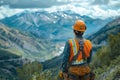 Construction Worker Enjoys Breathtaking Mountain View Royalty Free Stock Photo