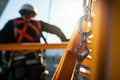 Construction Worker Ensuring Safety Wearing Safety Harness and Safety Line in High-Risk Environment. created with Generative AI Royalty Free Stock Photo