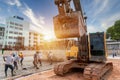 Construction worker with excavator heavy machine and cement truck for Concrete pouring during commercial concreting floors at Royalty Free Stock Photo