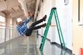 Construction worker falling off the ladder Royalty Free Stock Photo