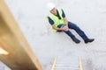 Construction Worker Falling Off Ladder And Injuring Leg Royalty Free Stock Photo