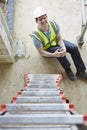 Construction Worker Falling Off Ladder And Injuring Leg Royalty Free Stock Photo