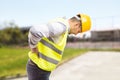 Construction worker feeling backpain in lumbar area Royalty Free Stock Photo