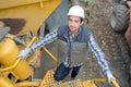 Construction worker going up steps on cement mixer truck Royalty Free Stock Photo